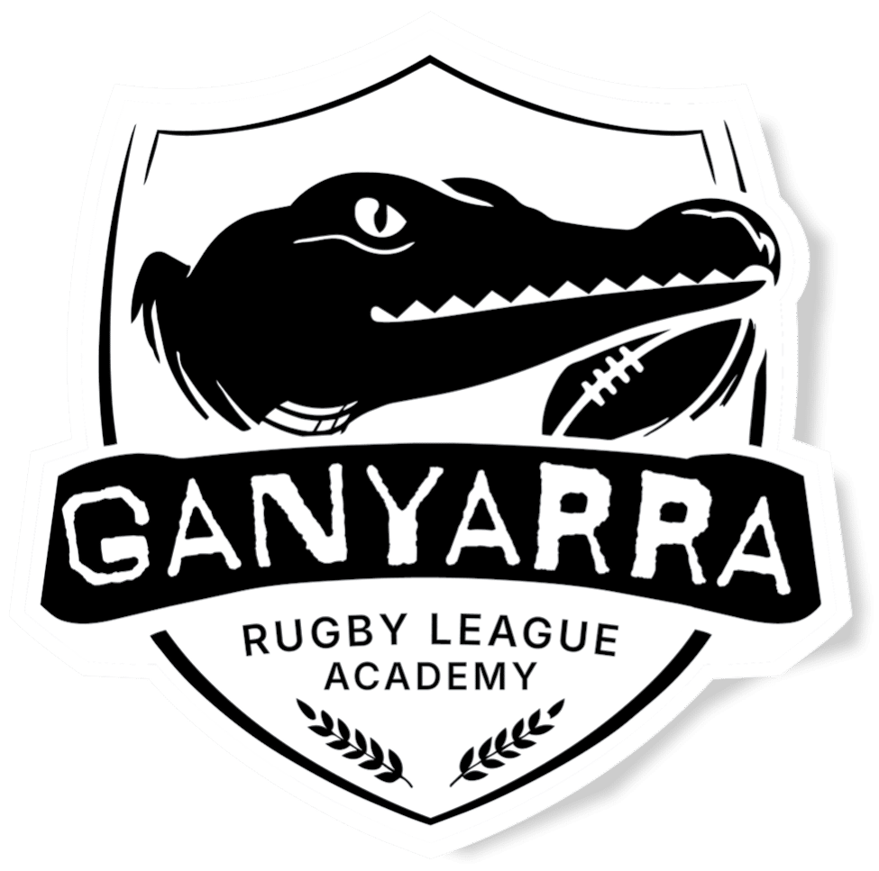Shield emblem for ganyarra rugby league academy featuring a crocodile head rugby ball and bold ganyarra text